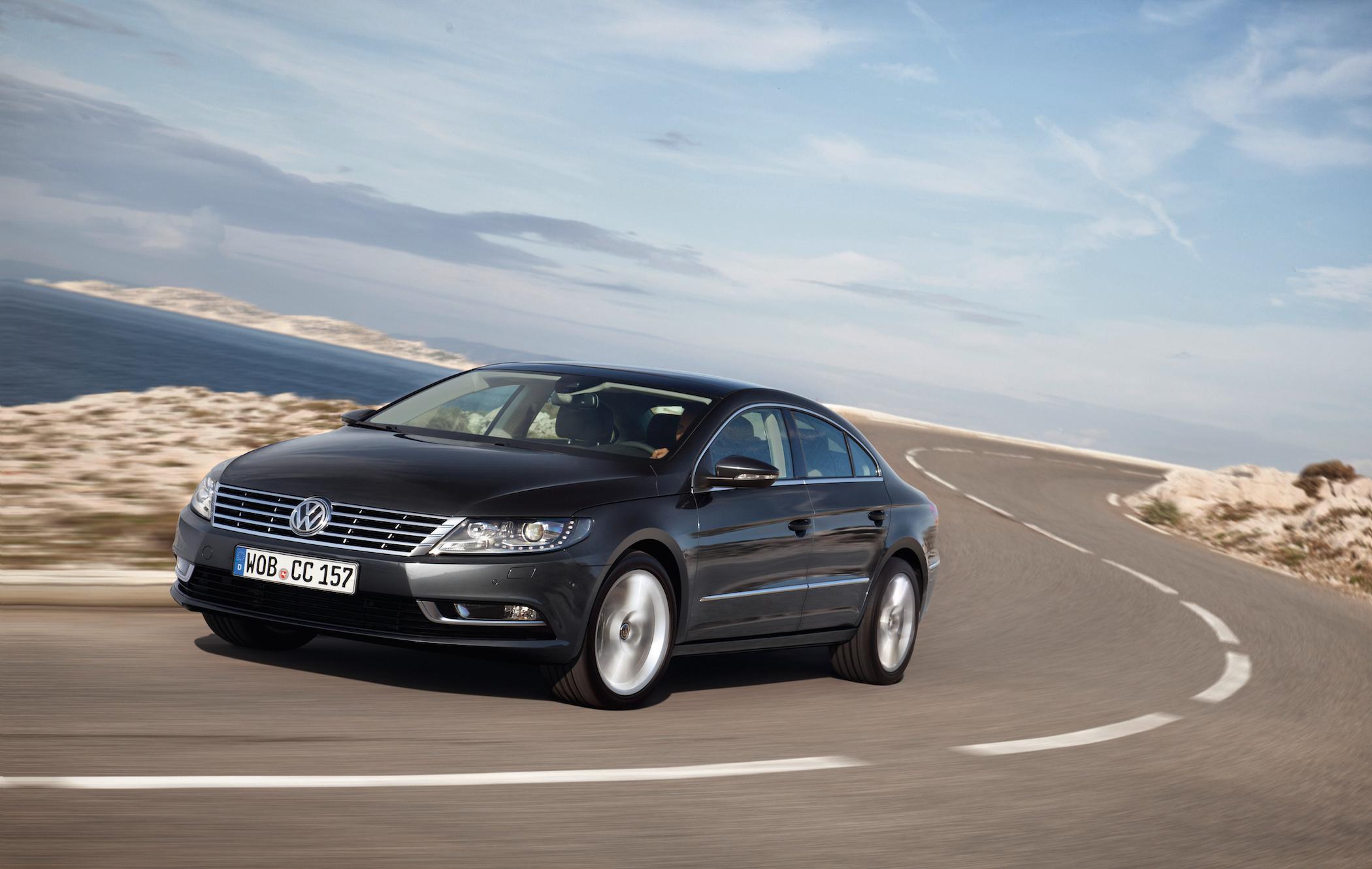 grey volkswagen CC driving on a curved road