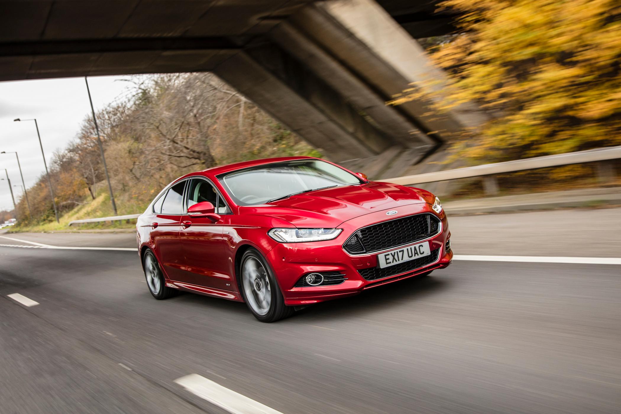 red ford mondeo driving
