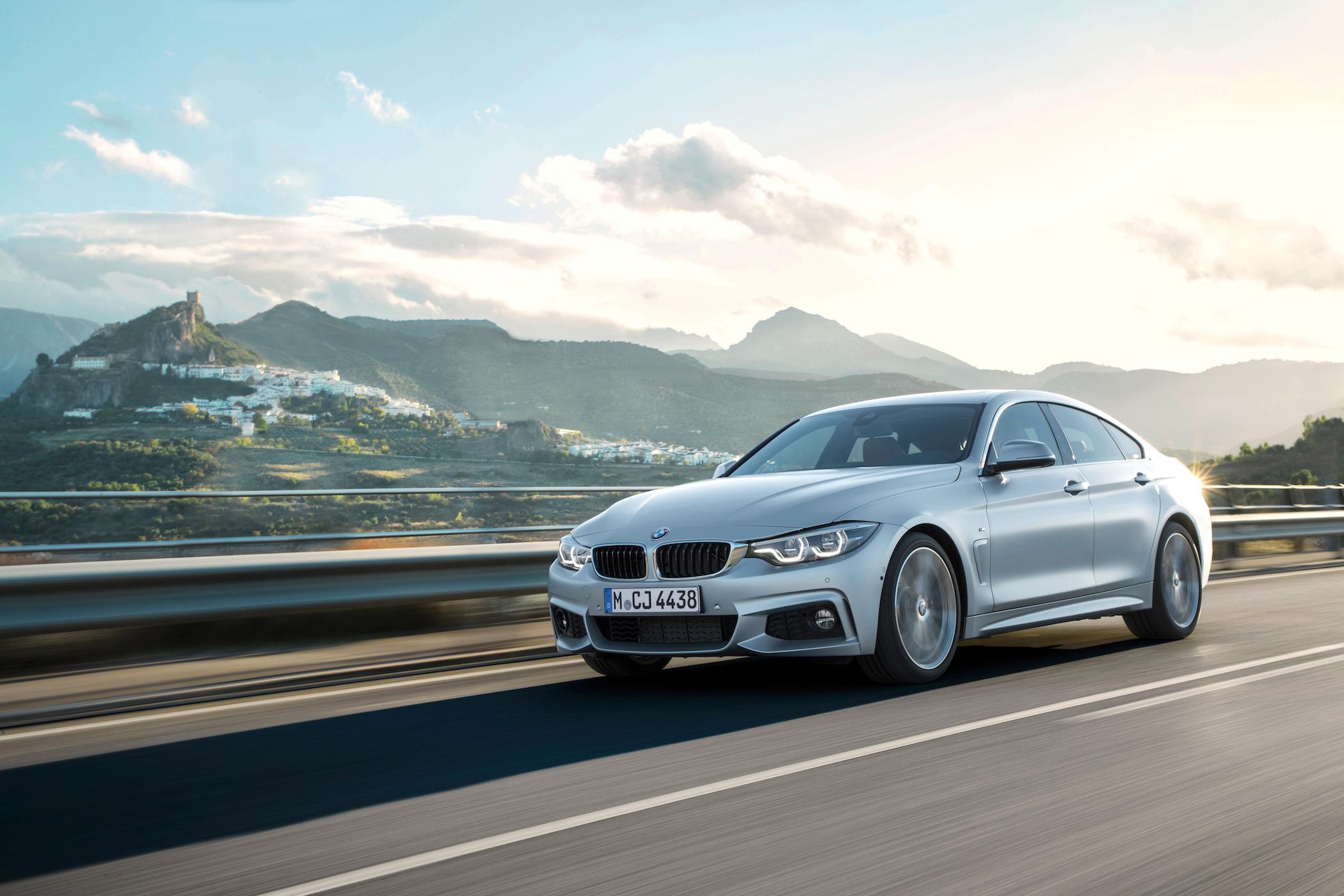 BMW 4 Series M Sport in silver driving 