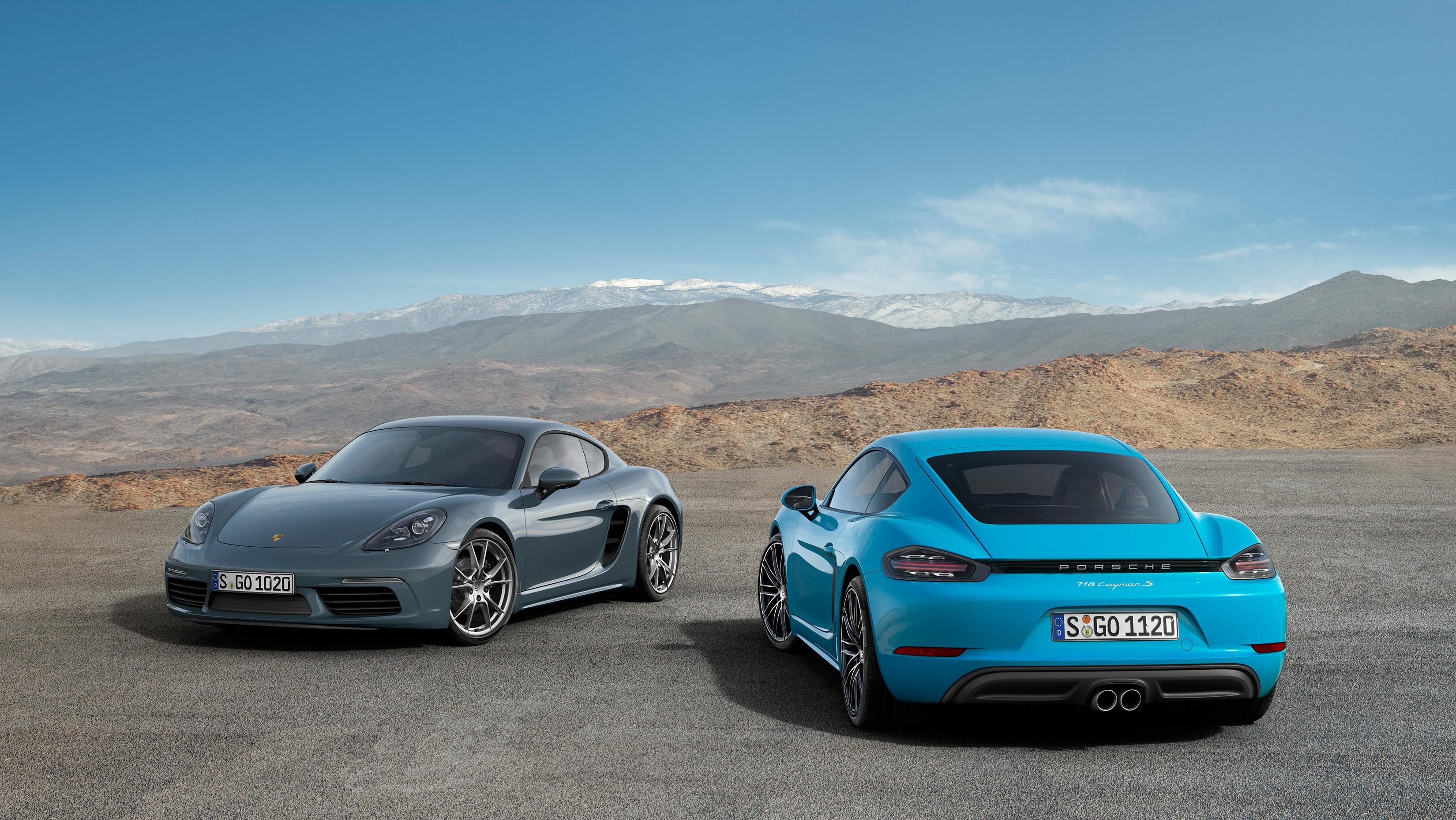 a grey 718 cayman front and a miami blue cayman s rear