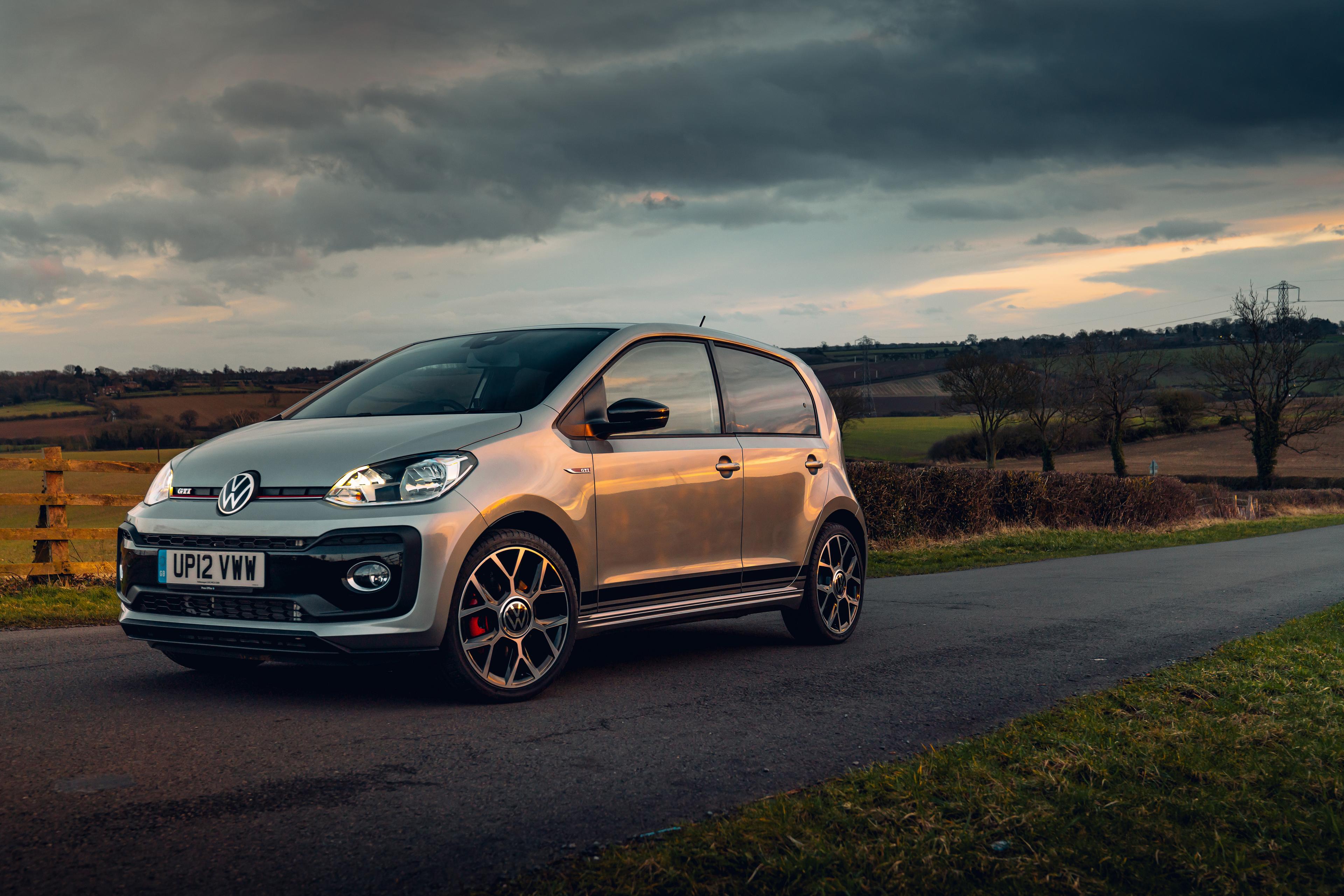 silver VW Up GTI parked on a country road