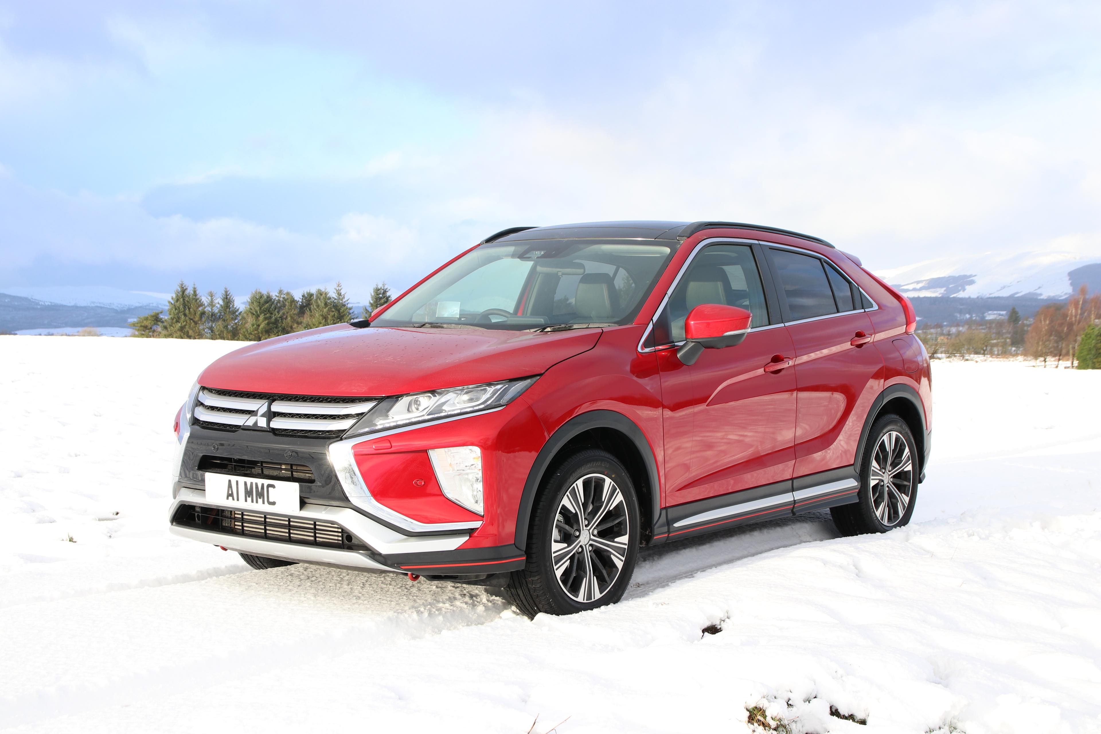 red mitsubishi eclipse cross in snow